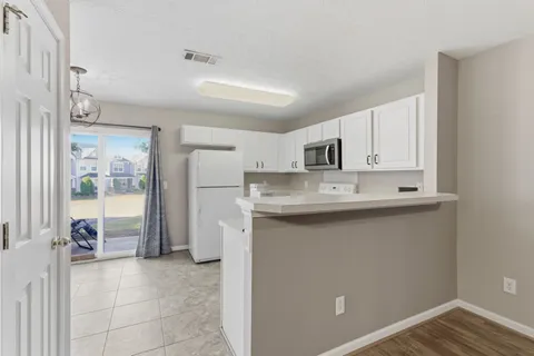 a kitchen with stainless steel appliances a sink stove and refrigerator