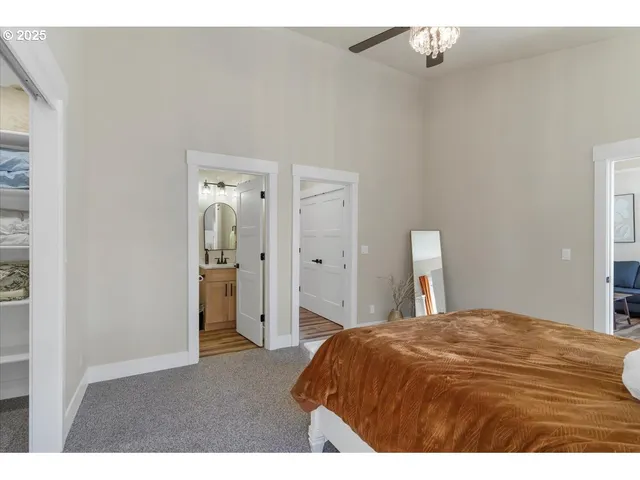 a bedroom with a bed and a lamp