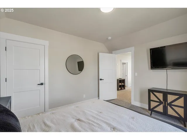 a view of a livingroom with furniture and a flat screen tv