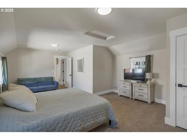 a bedroom with a bed and furniture