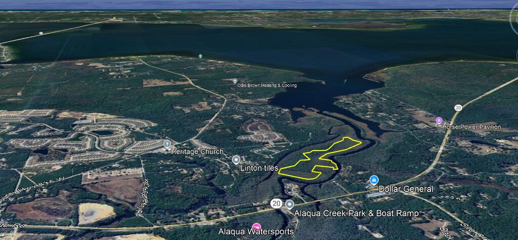 1 Alaqua Cove Road Freeport, FL 32439 - Photo 3 of 7 an aerial view of a house