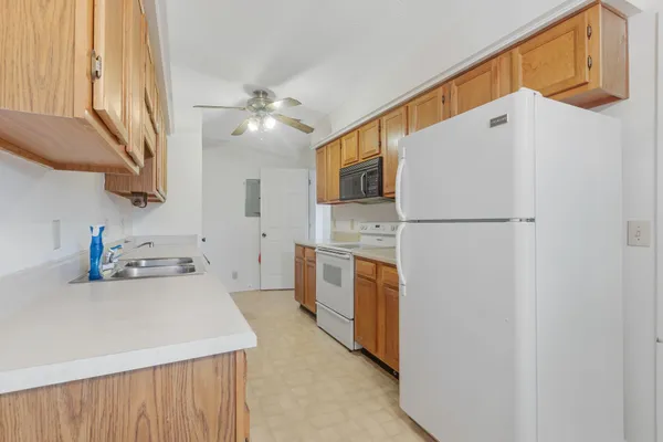 a kitchen with a refrigerator a sink and dishwasher