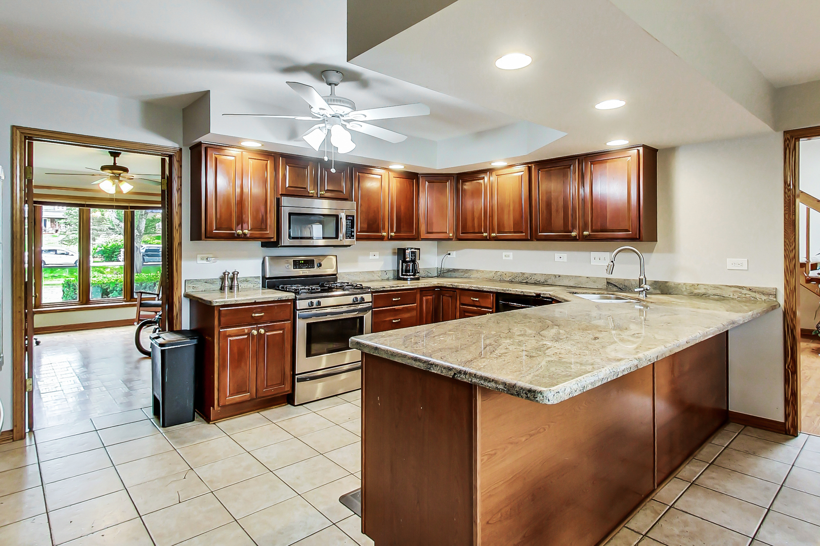 1149 North Doe Road Palatine, IL 60067 - Photo 15 of 46 a kitchen with stainless steel appliances granite countertop a stove top oven a sink dishwasher and a refrigerator