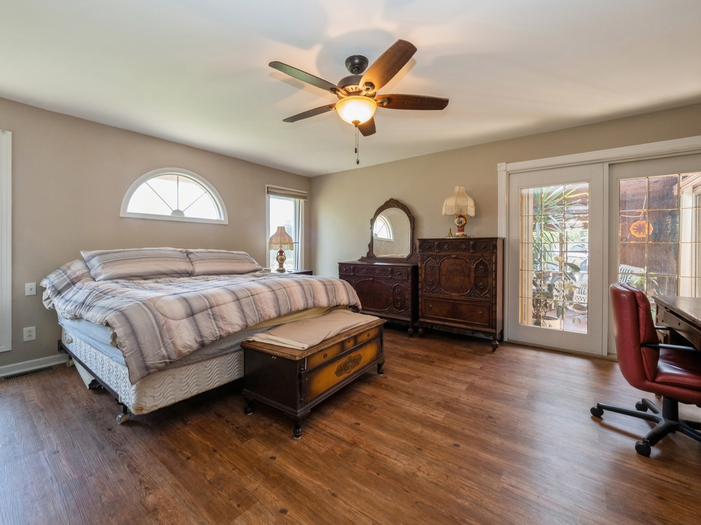 1149 North Doe Road Palatine, IL 60067 - Photo 23 of 46 a bedroom with a large bed and a chandelier