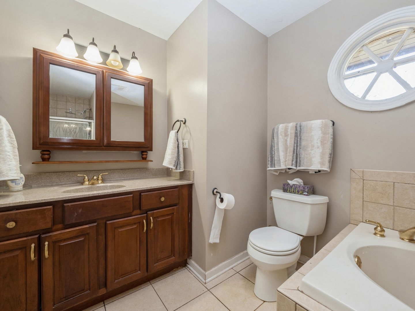 1149 North Doe Road Palatine, IL 60067 - Photo 27 of 46 a bathroom with a toilet sink and mirror