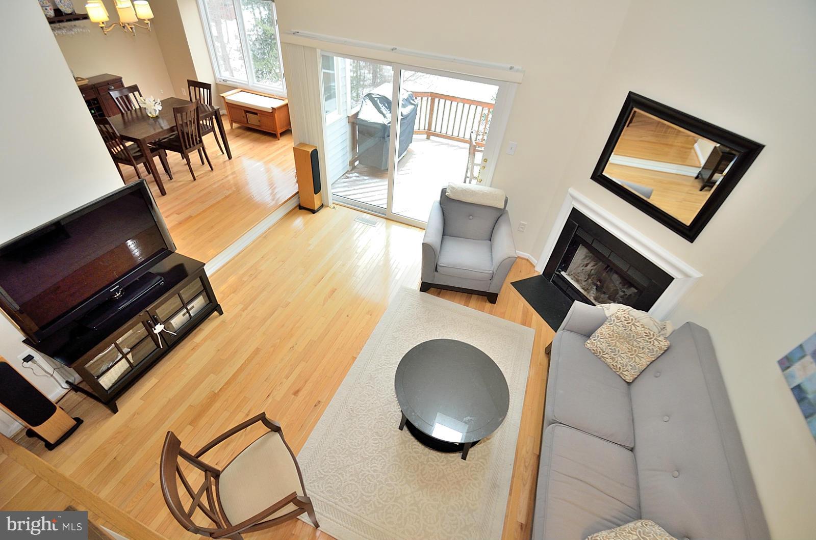 1283 Wedgewood Manor Way Reston, VA 20194 - Photo 11 of 27 a living room with chairs and a flat screen tv