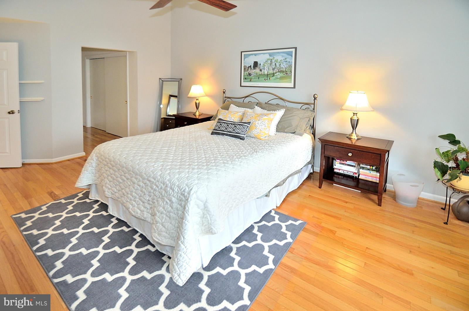 1283 Wedgewood Manor Way Reston, VA 20194 - Photo 13 of 27 a bedroom with a bed and wooden floor