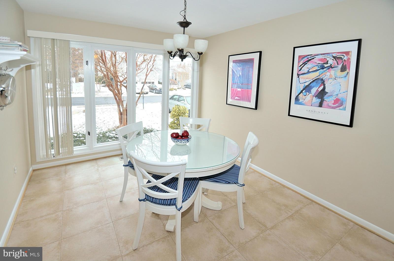 1283 Wedgewood Manor Way Reston, VA 20194 - Photo 3 of 27 a dining room with furniture and window