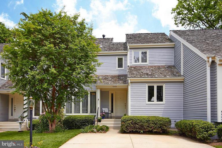 1283 Wedgewood Manor Way Reston, VA 20194 - Photo 27 of 27 a front view of a house with a yard