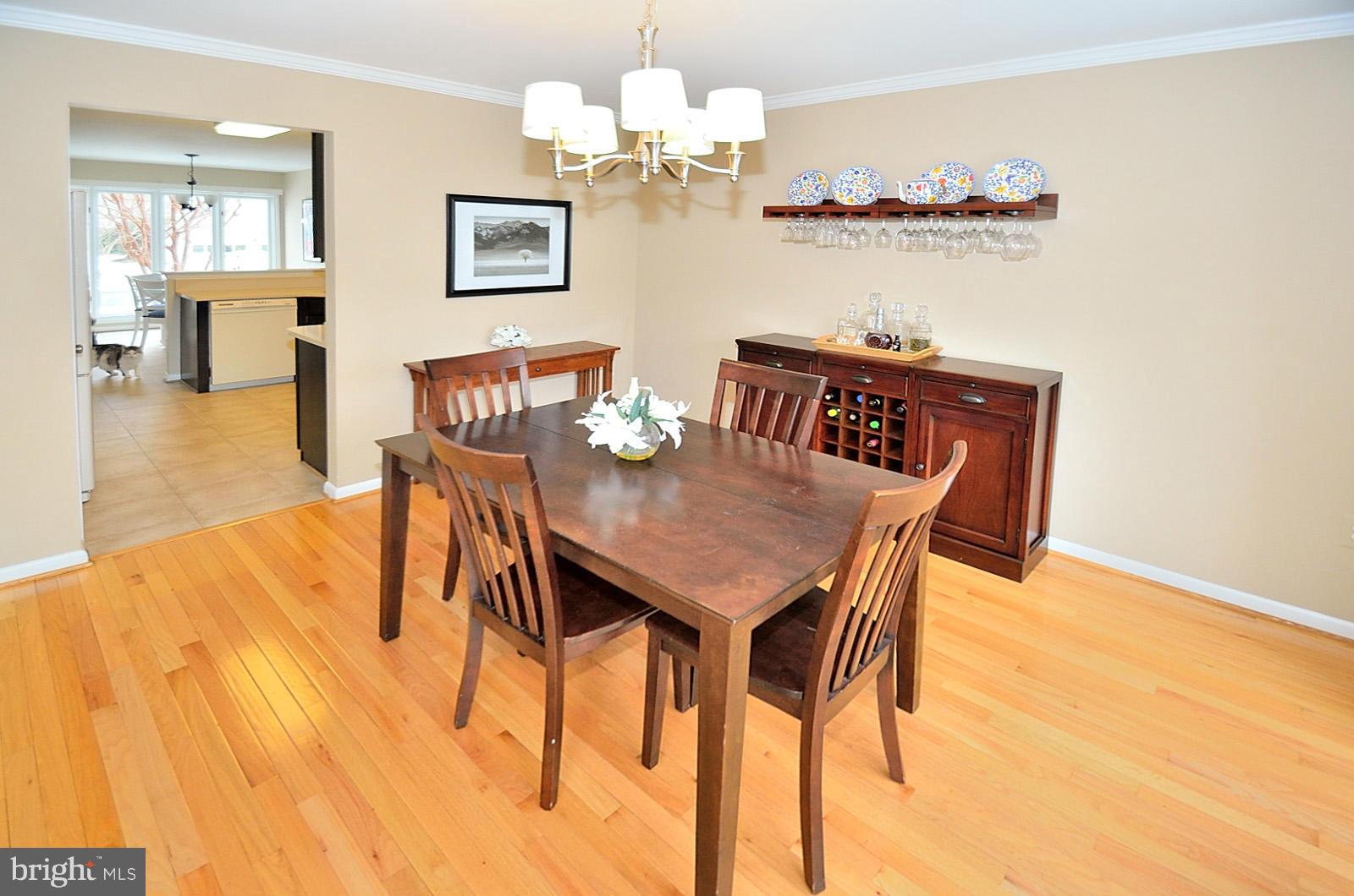 1283 Wedgewood Manor Way Reston, VA 20194 - Photo 7 of 27 a view of a dining room with furniture and wooden floor