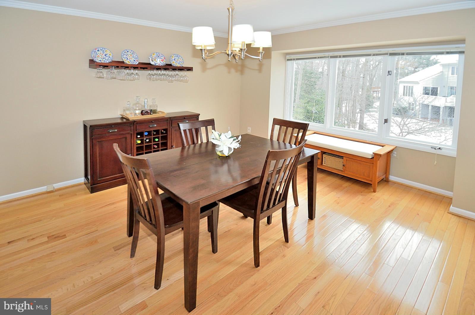 1283 Wedgewood Manor Way Reston, VA 20194 - Photo 8 of 27 a dining room with furniture and wooden floor