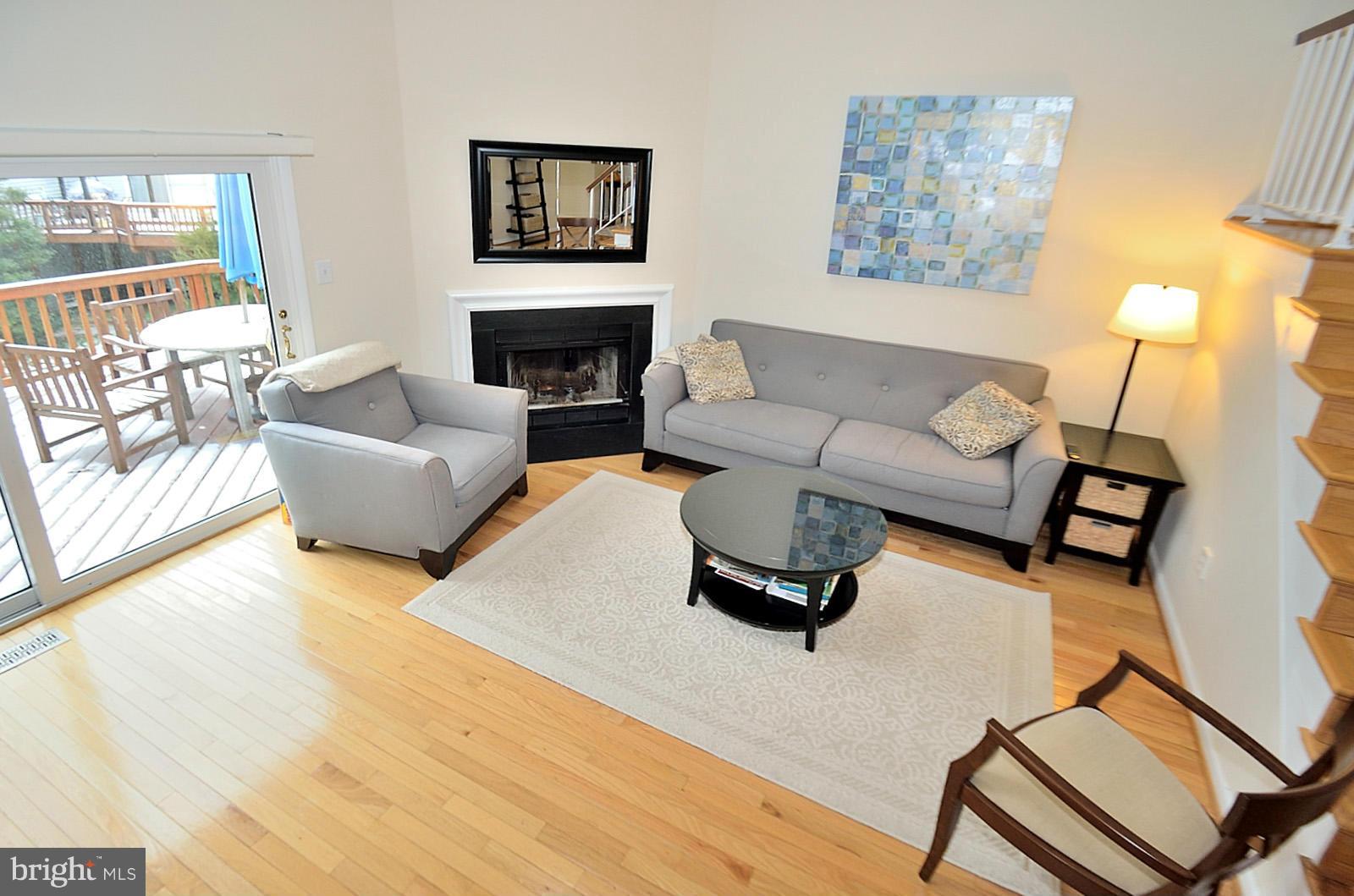 1283 Wedgewood Manor Way Reston, VA 20194 - Photo 9 of 27 a living room with furniture and a fireplace