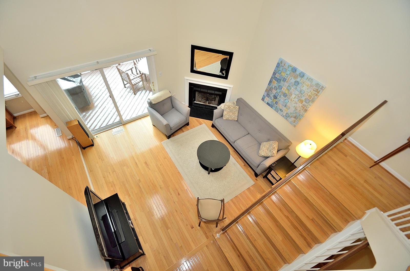 1283 Wedgewood Manor Way Reston, VA 20194 - Photo 10 of 27 a living room with furniture and a flat screen tv