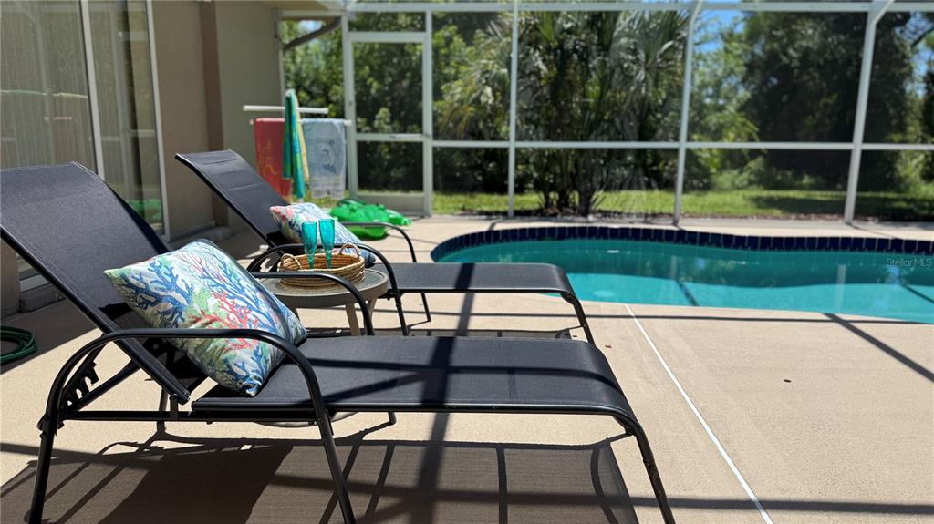 70 Tournament Road Rotonda West, FL 33947 - Photo 24 of 47 a view of a chairs and table in patio