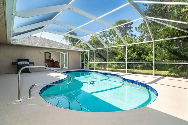 a view of a swimming pool with an outdoor seating
