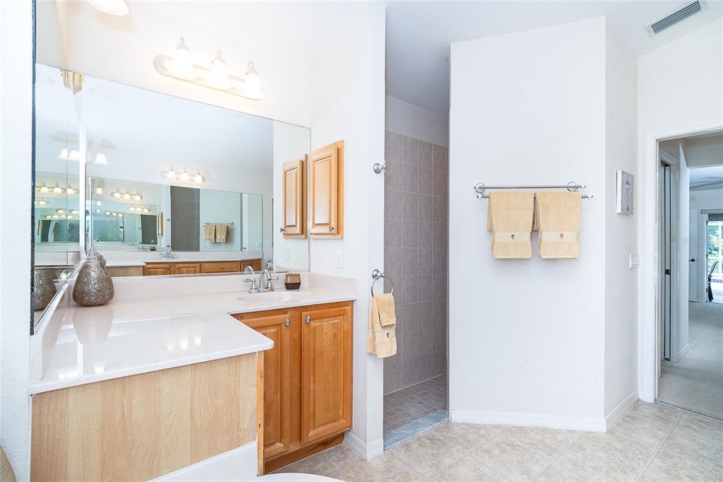 70 Tournament Road Rotonda West, FL 33947 - Photo 34 of 47 a kitchen with sink and refrigerator