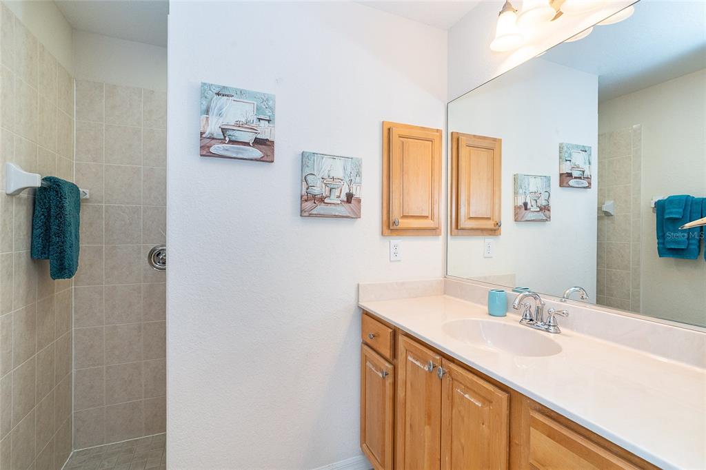 70 Tournament Road Rotonda West, FL 33947 - Photo 38 of 47 a bathroom with a sink and a mirror