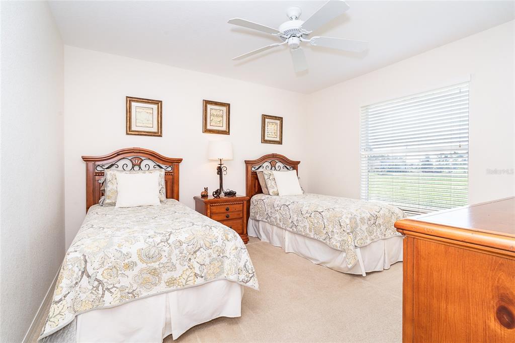 70 Tournament Road Rotonda West, FL 33947 - Photo 41 of 47 a bedroom with two beds and a window