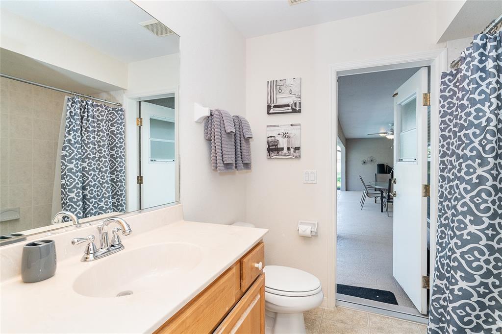 70 Tournament Road Rotonda West, FL 33947 - Photo 43 of 47 a bathroom with a sink toilet and shower