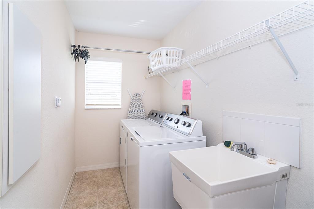 70 Tournament Road Rotonda West, FL 33947 - Photo 44 of 47 a utility room with dryer and washer