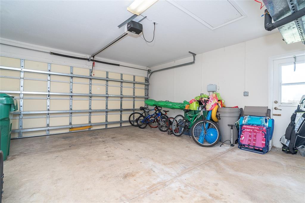 70 Tournament Road Rotonda West, FL 33947 - Photo 45 of 47 a view of a garage with a table and a chairs