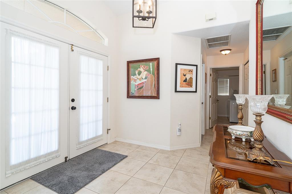 70 Tournament Road Rotonda West, FL 33947 - Photo 7 of 47 a view of a hallway with workspace and a window