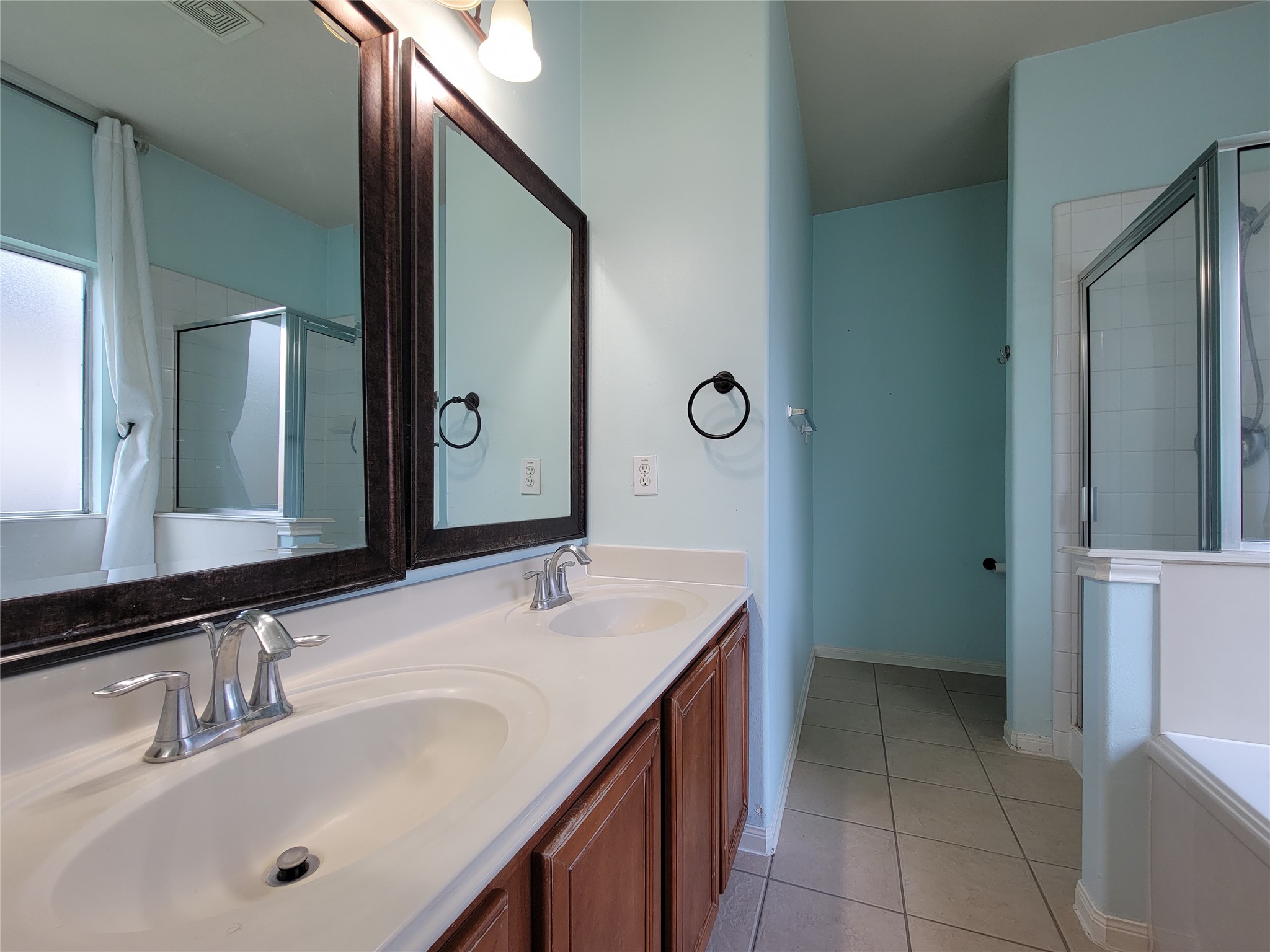 25223 Hazel Ranch Drive Katy, TX 77494 - Photo 9 of 20 a bathroom with a sink and a mirror