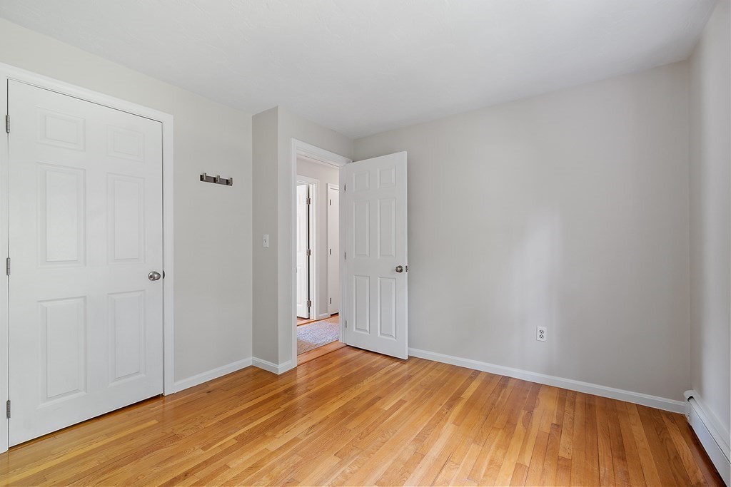 5 Thicket Circle Stow, MA 01775 - Photo 26 of 37 a view of empty room with wooden floor