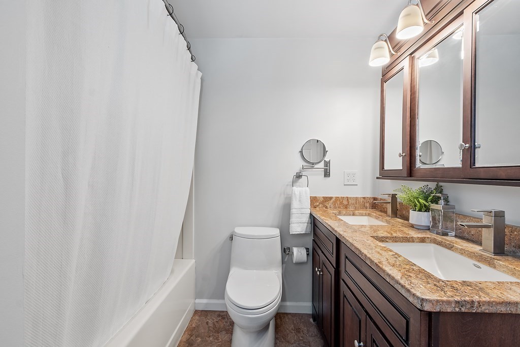 5 Thicket Circle Stow, MA 01775 - Photo 28 of 37 a bathroom with a granite countertop sink vanity mirror and toilet