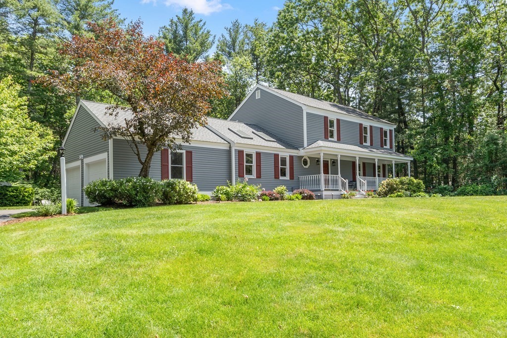 5 Thicket Circle Stow, MA 01775 - Photo 5 of 37 a front view of a house with a garden