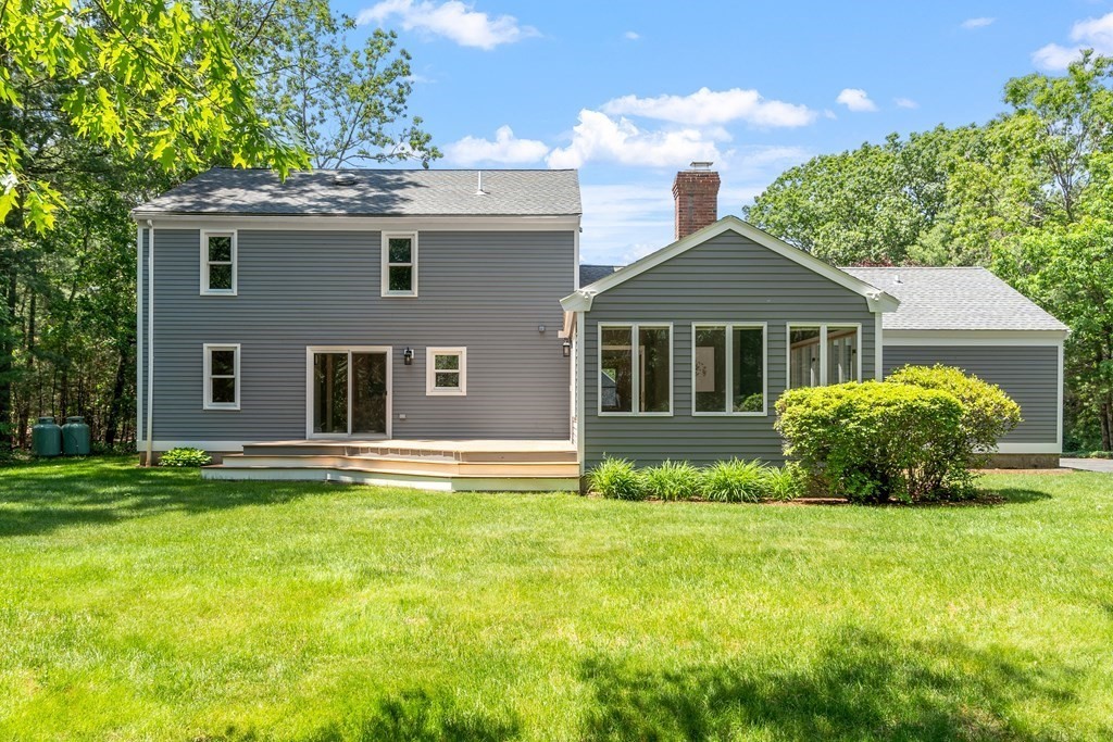 5 Thicket Circle Stow, MA 01775 - Photo 7 of 37 a front view of a house with a garden