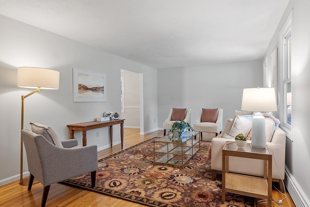 5 Thicket Circle Stow, MA 01775 - Photo 8 of 37 a living room with furniture a lamp and a rug