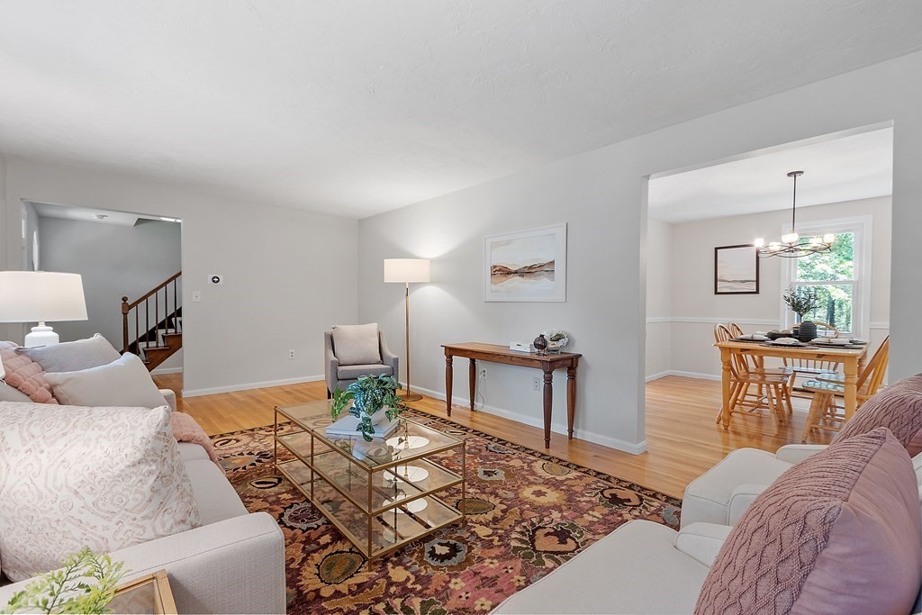 5 Thicket Circle Stow, MA 01775 - Photo 9 of 37 a living room with furniture a rug and a table