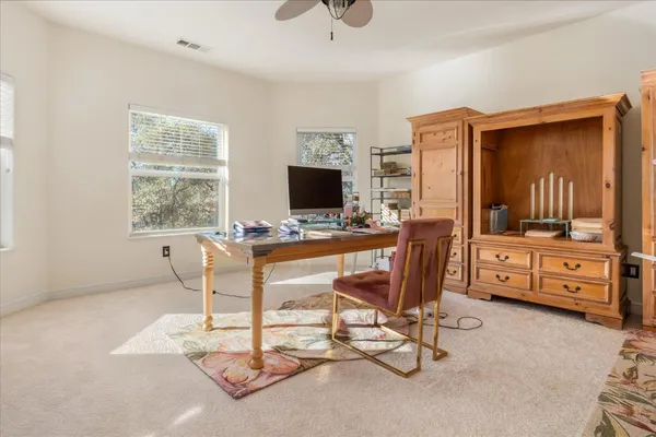 a workspace with furniture and a window