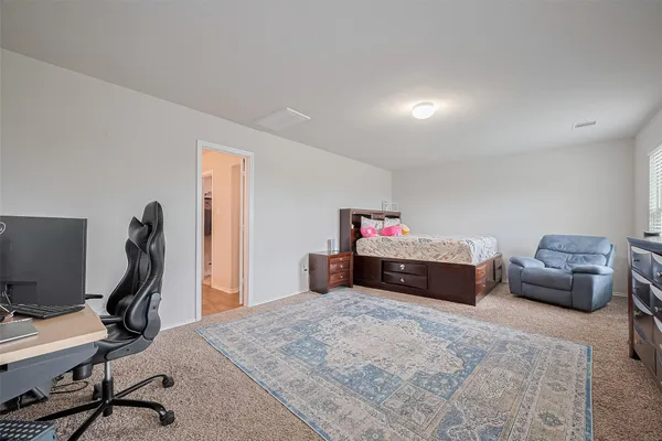 a bedroom with furniture and a bed