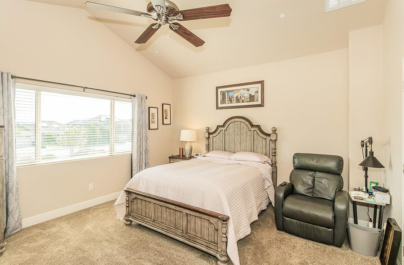 2043 North Soledad Avenue Clovis, CA 93619 - Photo 14 of 33 a bedroom with a bed couch and window