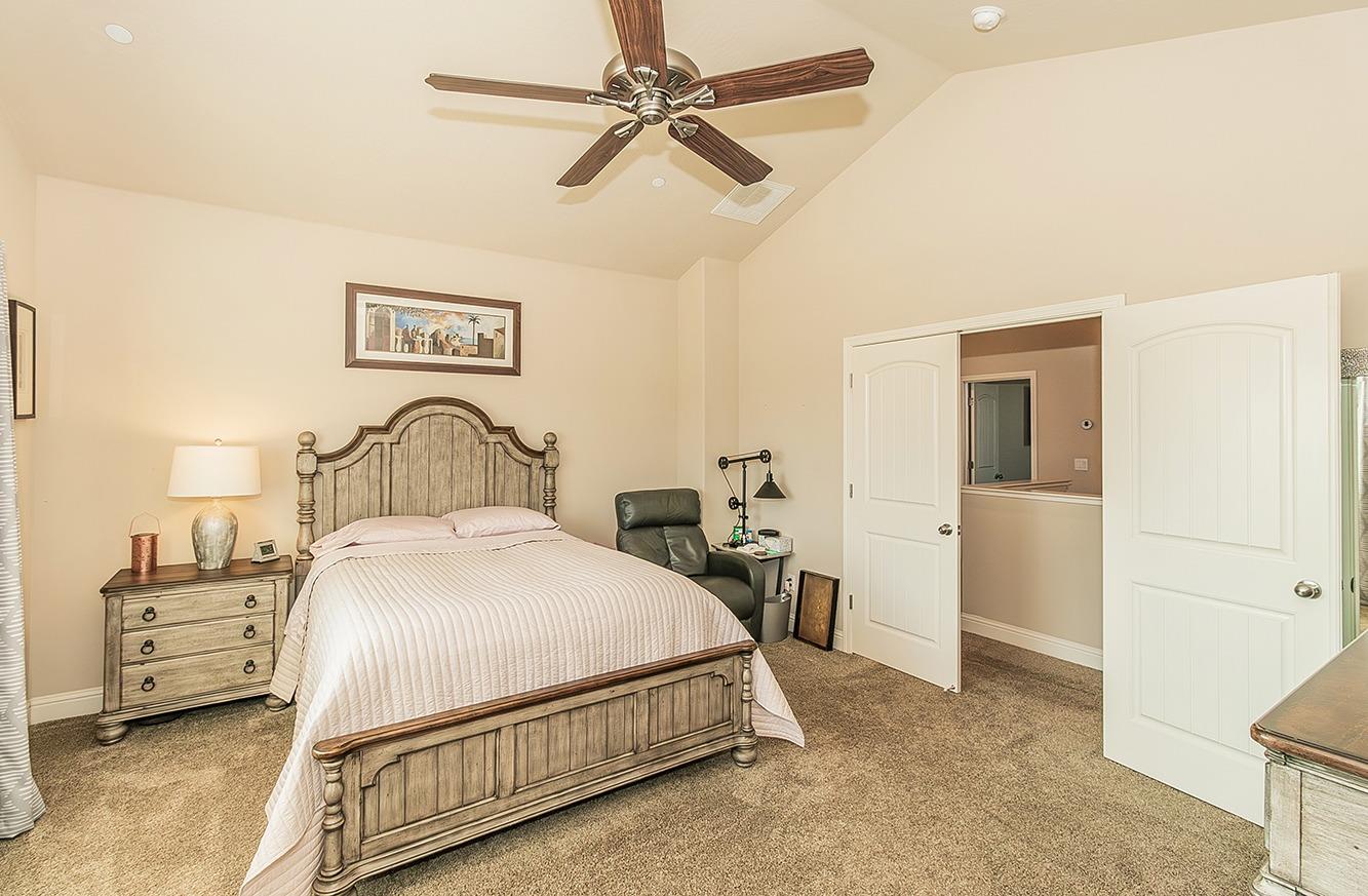 2043 North Soledad Avenue Clovis, CA 93619 - Photo 15 of 33 a bedroom with a bed and a table