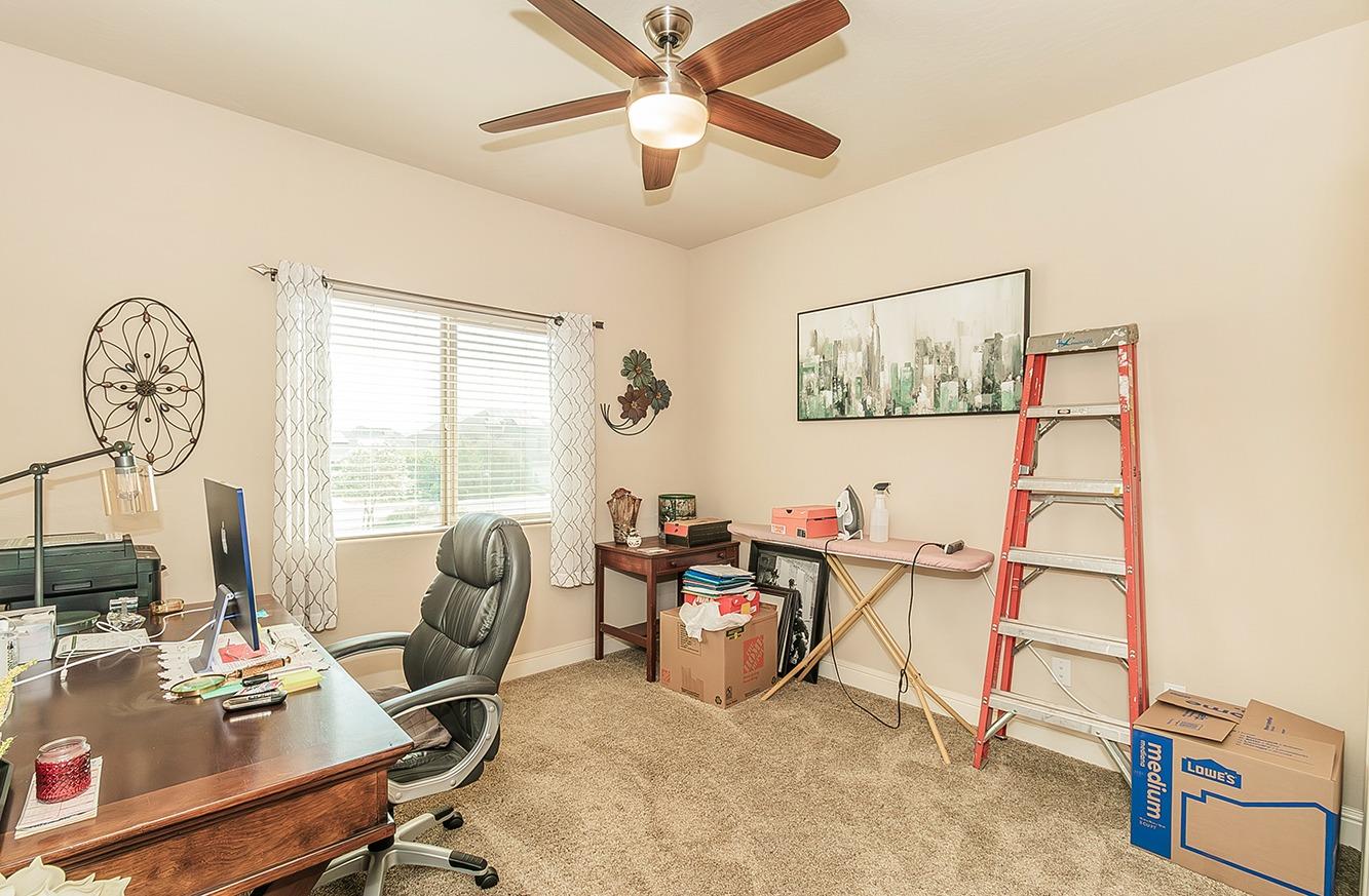 2043 North Soledad Avenue Clovis, CA 93619 - Photo 21 of 33 a view of a workspace with furniture and a window