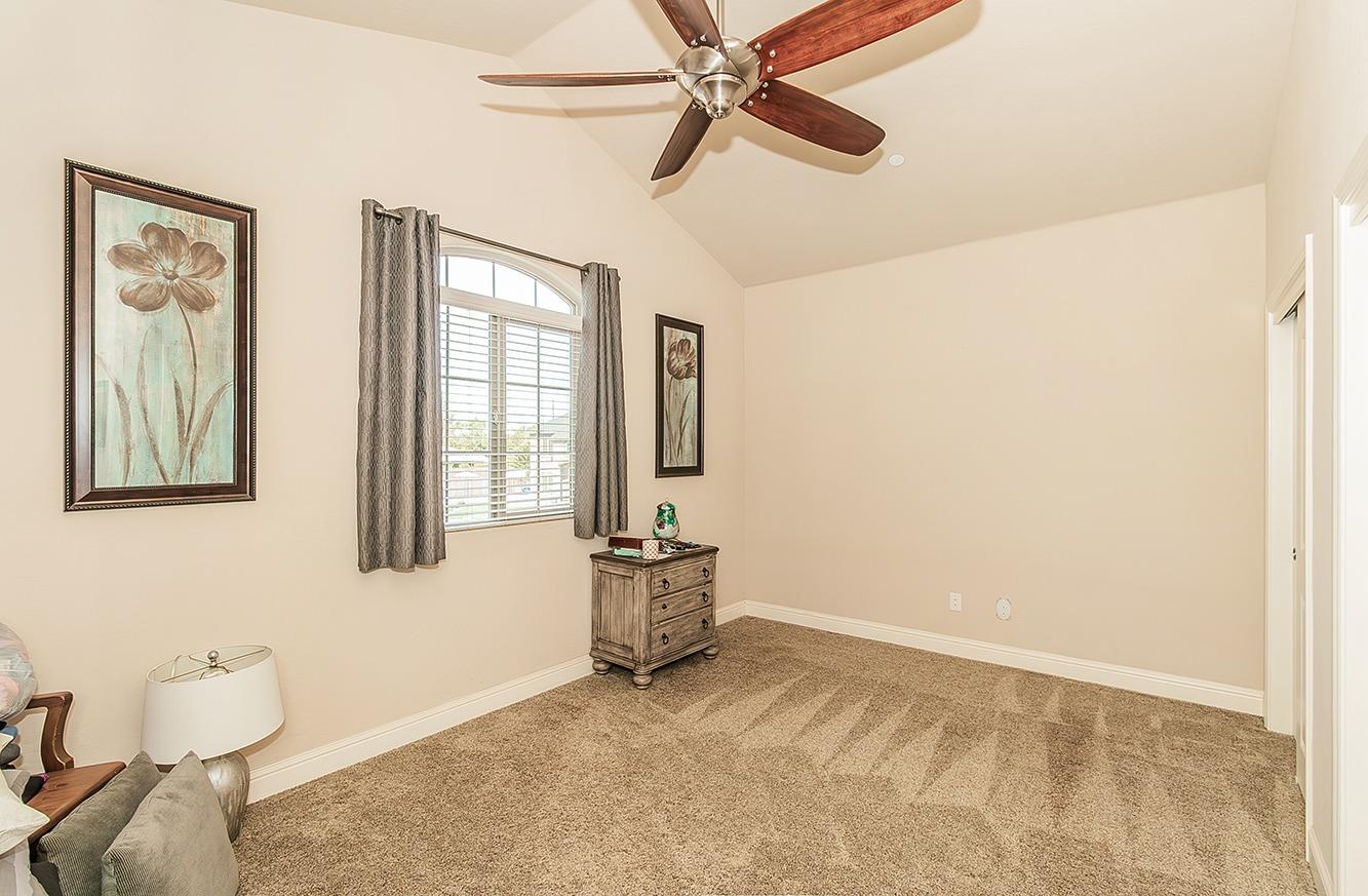 2043 North Soledad Avenue Clovis, CA 93619 - Photo 24 of 33 a bedroom with a bed and furniture