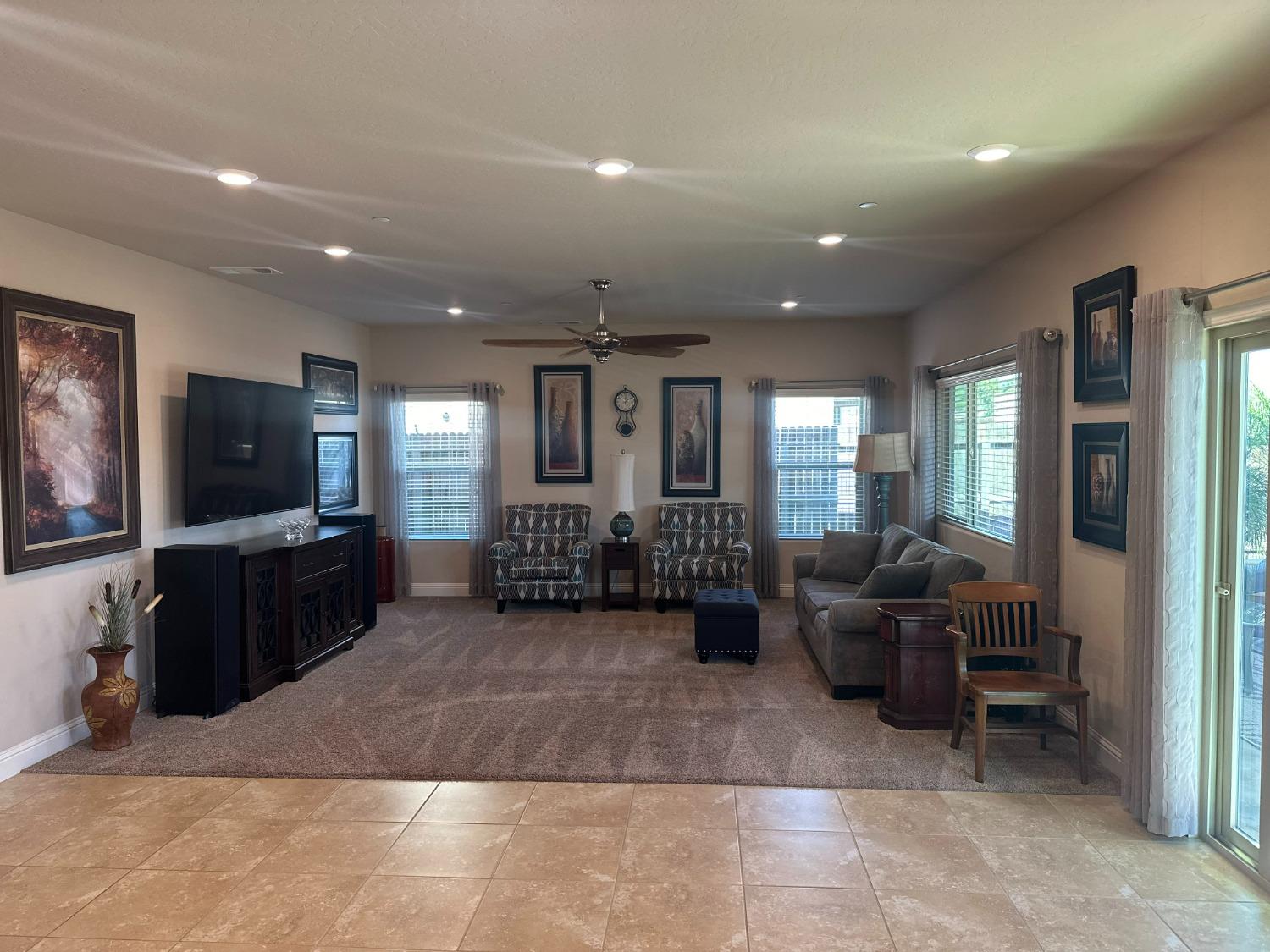 2043 North Soledad Avenue Clovis, CA 93619 - Photo 4 of 33 a living room with furniture and a flat screen tv
