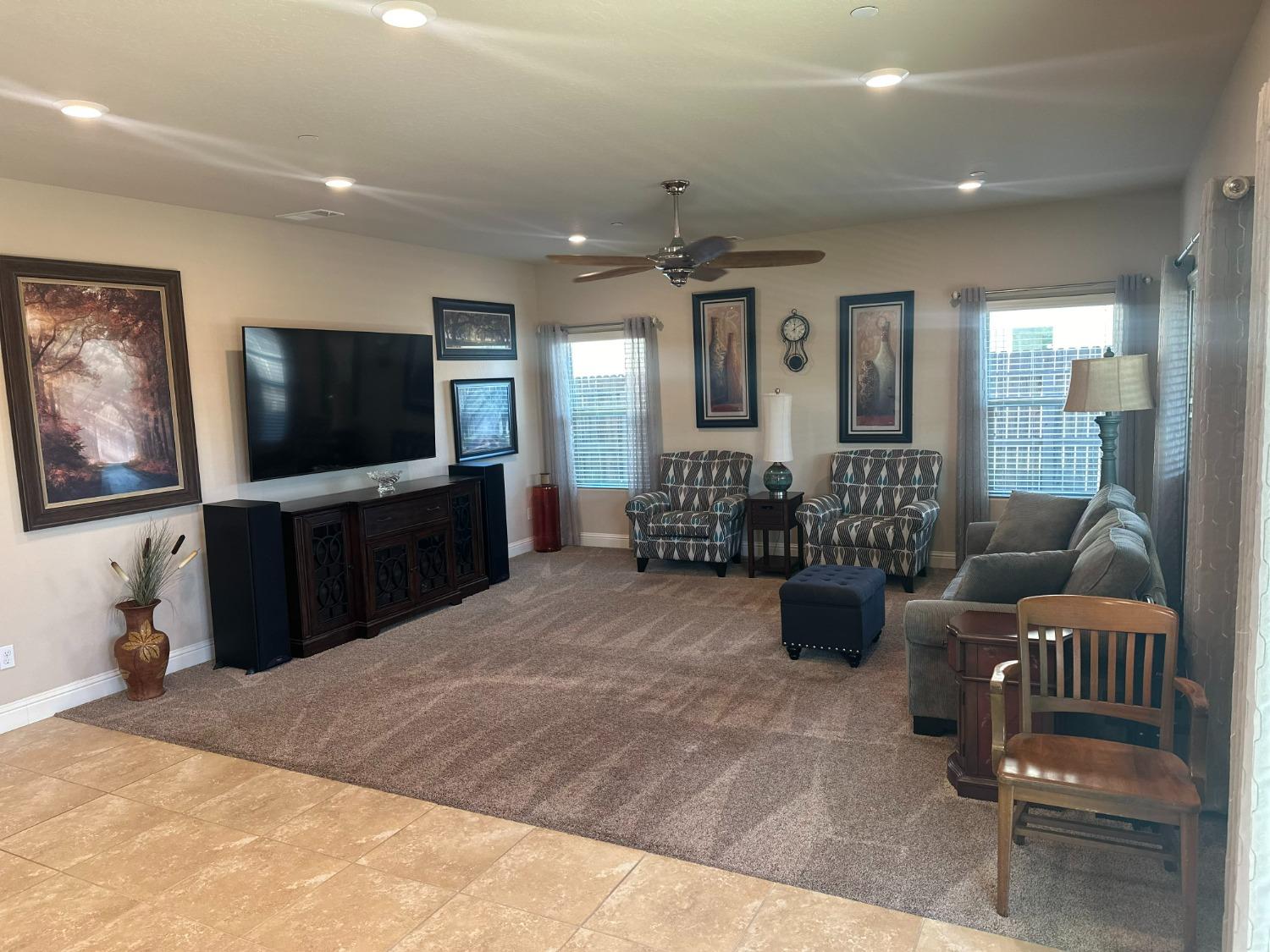 2043 North Soledad Avenue Clovis, CA 93619 - Photo 8 of 33 a living room with furniture and a flat screen tv