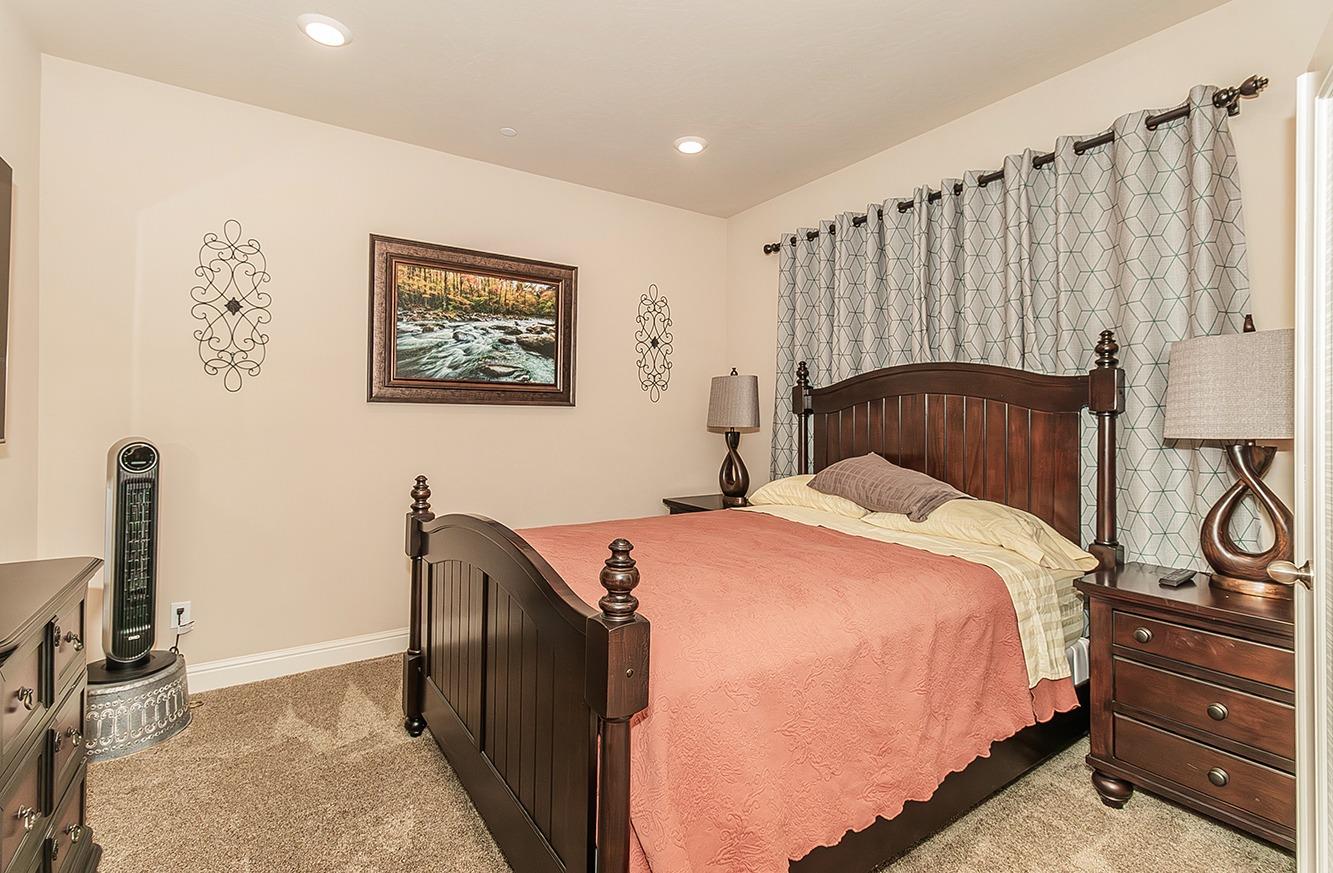 2043 North Soledad Avenue Clovis, CA 93619 - Photo 10 of 33 a bedroom with a bed and a dresser