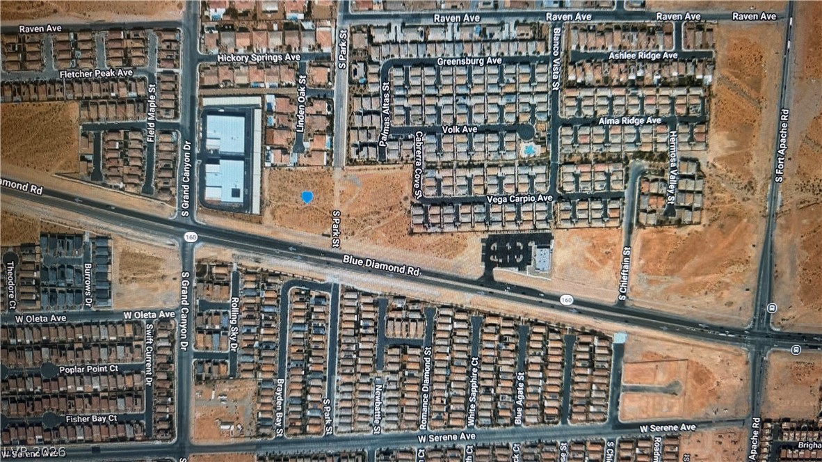 0 Blue Diamond Road Las Vegas, NV 89178 - Photo 4 of 25 An overhead view reveals a well-developed neighborhood nestled among natural desert landscape.