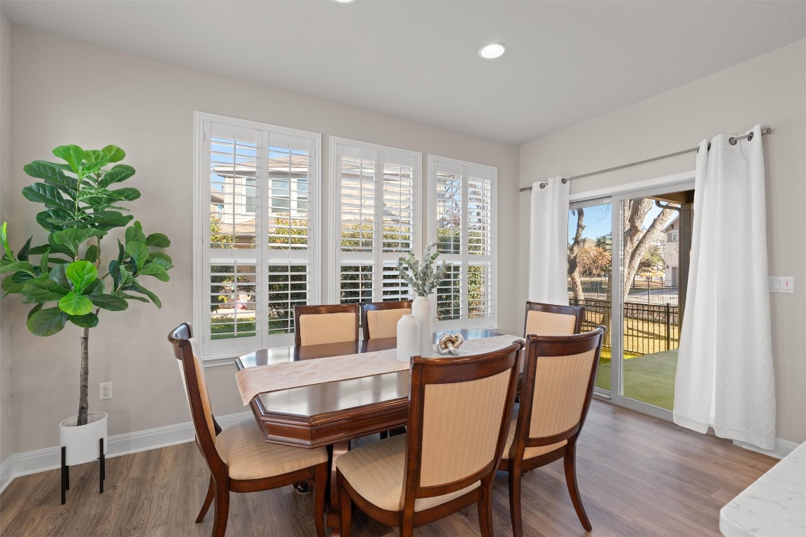 10502 Turnbull Loop, Unit 41 Austin, TX 78717 - Photo 10 of 29 Dining room with beautiful luxury vinyl plank floors and recessed lighting