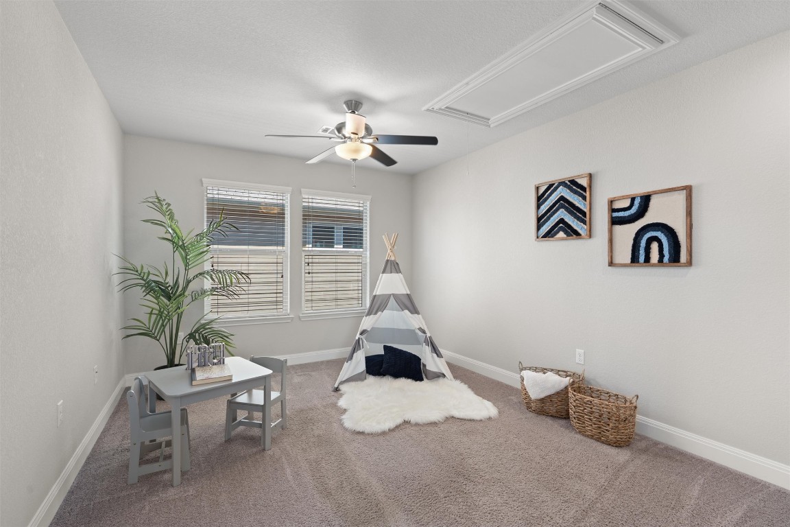 10502 Turnbull Loop, Unit 41 Austin, TX 78717 - Photo 13 of 29 Recreation room featuring attic access, carpet, and ceiling fan