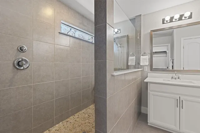 a bathroom with a double vanity sink and mirror