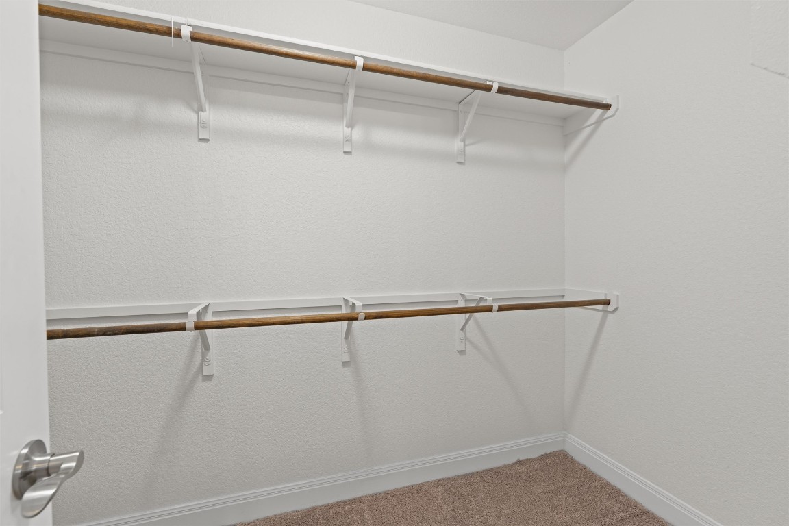 10502 Turnbull Loop, Unit 41 Austin, TX 78717 - Photo 18 of 29 Walk in closet featuring carpet