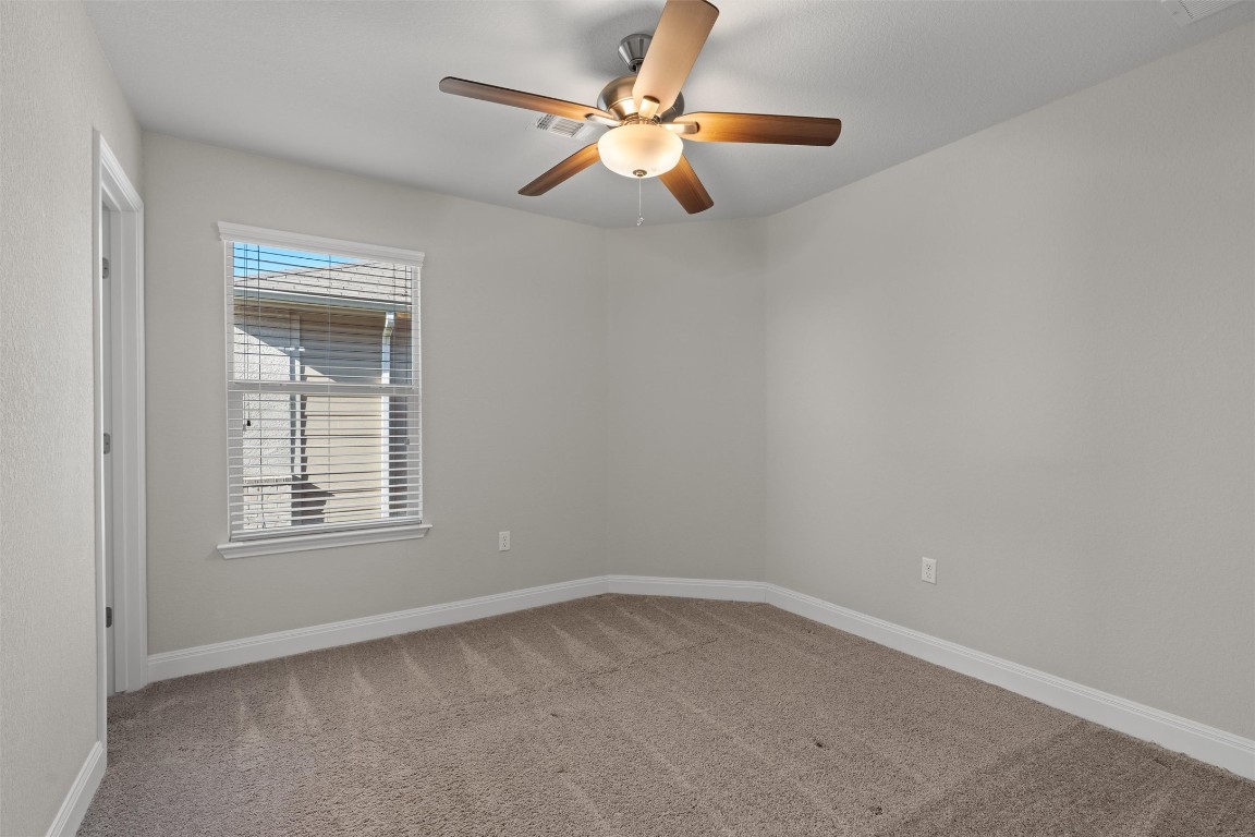 10502 Turnbull Loop, Unit 41 Austin, TX 78717 - Photo 19 of 29 Spare room featuring light colored carpet and ceiling fan