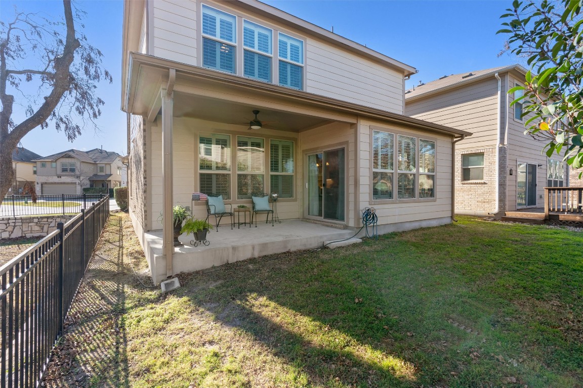 10502 Turnbull Loop, Unit 41 Austin, TX 78717 - Photo 26 of 29 Rear view of property featuring ceiling fan and a patio area