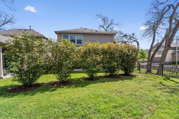 a view of a house with sitting area and a small yard
